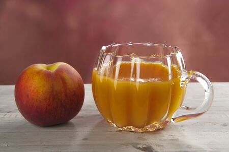 Peach juice in a glassの写真素材