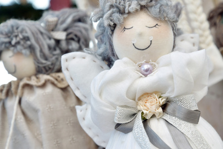 cloth doll with flower and woolen hatsの写真素材