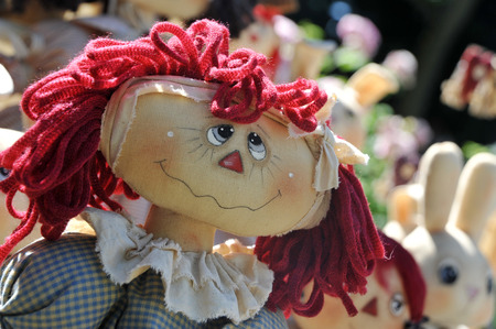 cloth doll with nice expression and red wool hatsの写真素材