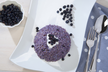 rice bilberry served with cranberriesの写真素材