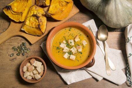pumpkin soup and pumpkin baked with rustic atmosphereの写真素材