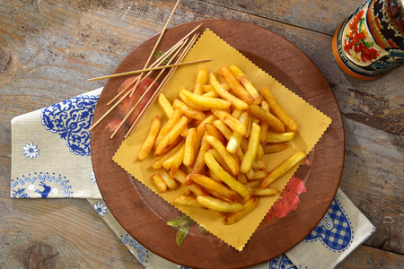 french fries and beer mug on the wooden tableの写真素材