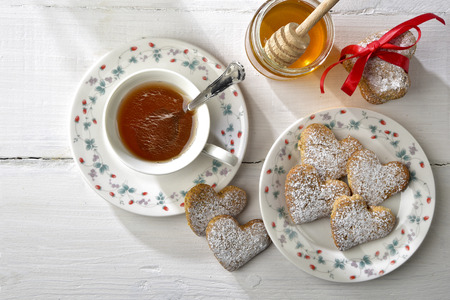 handmade biscuits in shape of heart served with theの写真素材