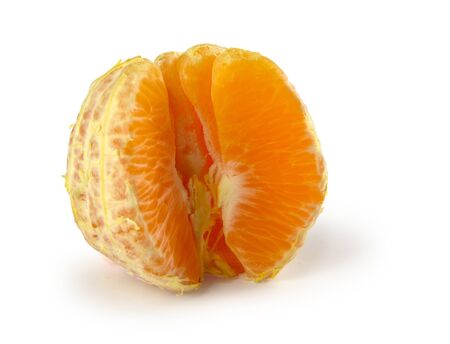 Half pealed orange with white backgroundの写真素材