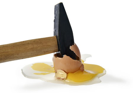 Broken egg with a hammer on a white backgroundの写真素材
