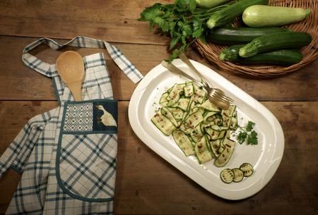 Tray with grilled zucchini in a rustic settingの写真素材