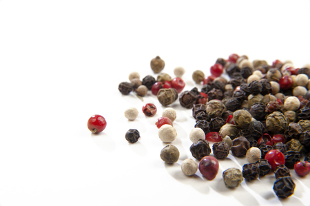 Mixed peppercorns on a white backgroundの写真素材