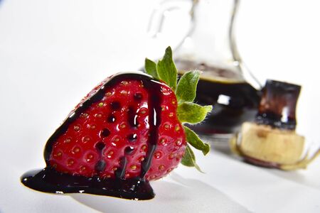 Drops of balsamic vinegar on a strawberryの写真素材