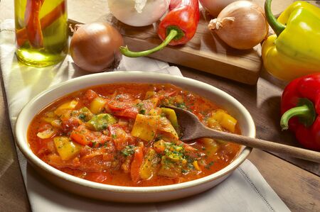 peppers cooked with tomatoes and sliced onions.の写真素材