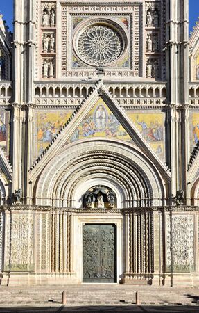 Facade of the cathedral of Orvieto in Italy, Gothic architecture with bas-reliefs, mosaics, paintings and sculpturesの写真素材
