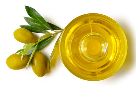 bottle of extra virgin olive oil with olives and leaves closeの写真素材