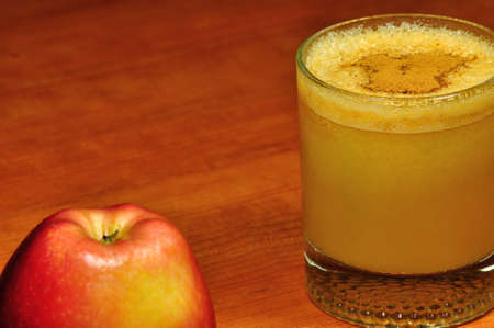 Fresh apple juice with cinnamon の写真素材
