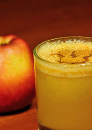 Fresh apple juice with cinnamon の写真素材