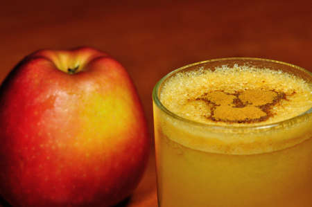 Fresh apple juice with cinnamon の写真素材