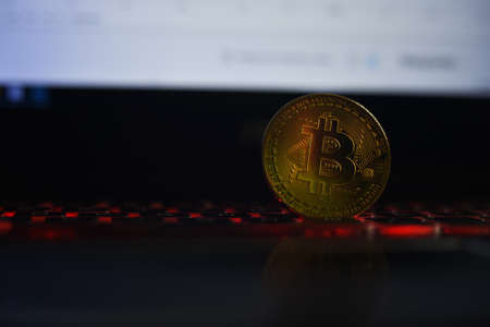 Bitcoin cryptocurrency on the keyboardの写真素材