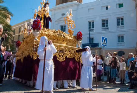 Easter procession during Holy Week in Spain. The float with Jesus figure. Cadiz, Andalucia, Spain