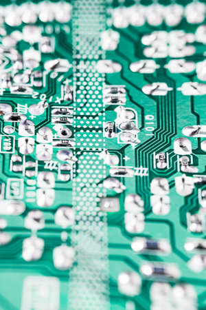Green circuit board background of computer motherboard macro shot