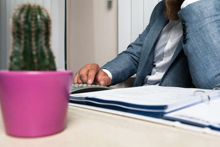 Businessman in office late night workの写真素材