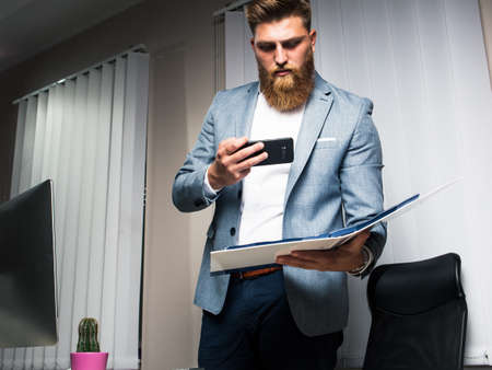 Businessman in office late night workの写真素材
