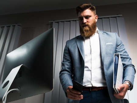 Businessman in office late night workの写真素材