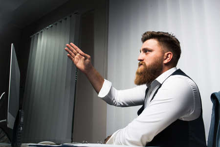 Businessman in office late night workの写真素材