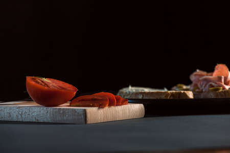 Sandwich with mortadela and tomato and olives