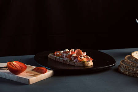 Sandwich with mortadela and tomato and olivesの写真素材