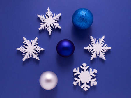 Christmas background with paper snowflake with soft shadows on light blue backgroundの写真素材