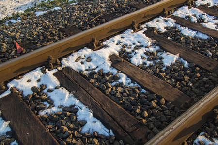 Old railroad on a setting January sunの写真素材
