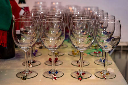 Wine glasses with Christmas wine charms for fun partyの写真素材