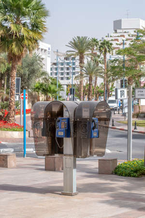 Israeli Bezek phone booth with 4 phones in Eilat, Israelのeditorial素材