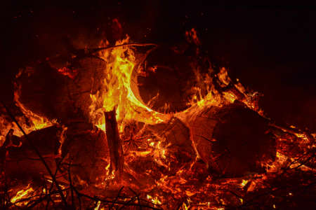 Close up of bonfire and hot orange embers in rural Minnesota, USAの写真素材