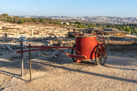 Red chariot and overview of the Nile house and Nazareth at Tzipori National Park in Israelの写真素材