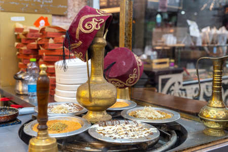Tea pot surrounded by different dessert cakes at Mahane Yehuda market in Jerusalem, Israel