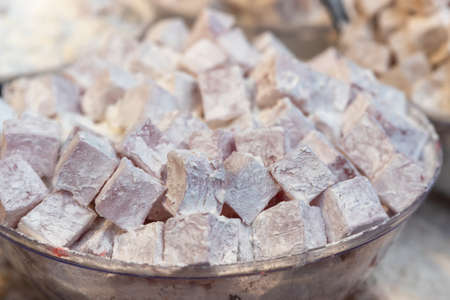 Close up of Turkish delight sweet treat with powdered sugar at Mahane Yehuda Market in Jerusalem,...