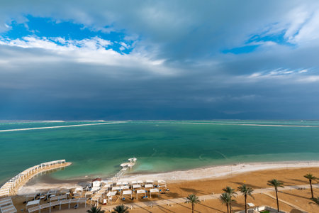 Panorama of the brilliant colors of the Dead Sea and the clouds on a Winter's day in Israel.