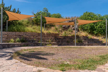 Shaded area for tourists to enjoy the view of the Jordan Valley at the ruins of Belvoir Fortress - Kokhav HaYarden National Park in Israel. Ruins of a Crusader castle.の写真素材