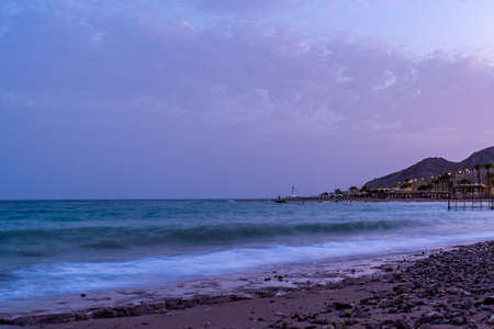 Dusk view outside of Eilat, Israel of Israel coastline and the Red Sea during the blue hour.の写真素材