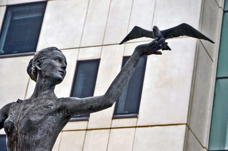 Statue of a woman with seagull  Cardiff  Wales  UKの写真素材