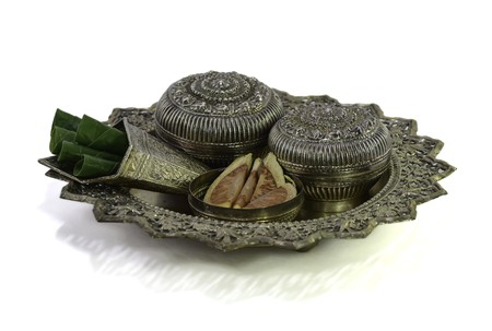 a silverware containing betel leaves and areca nutsの写真素材