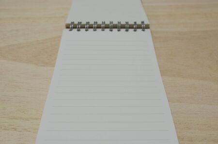 blank notebook on wood board