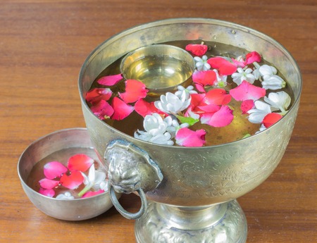 Water with jasmine and roses corolla in bowlの写真素材