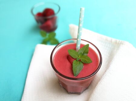 Strawberry smoothie in glass with strawの写真素材