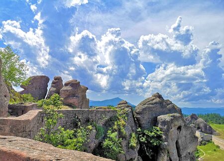 Blue sky covered by dense clouds over the Belogradchick Rocks, Bulgariaの写真素材