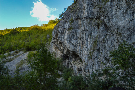 Rocky formation and lush green vegetation, sunshine over natural landscape in, Sohodol Gorges(Cheile Sohodolului), Valcan mountains, in Gorj county, Romaniaの写真素材