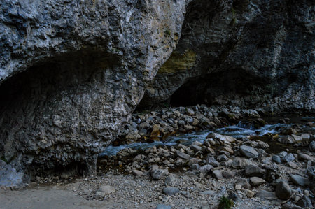 Pestera de la nara - old natural cave, Spectacular river tunnel at Sohodol Gorges(Cheile Sohodolului), Valcan mountains, in Gorj county, Romaniaの写真素材