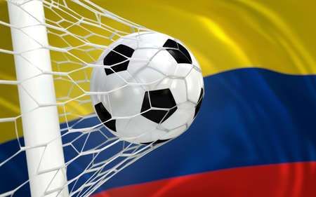 Colombia flag and soccer ball, football in goal netの写真素材