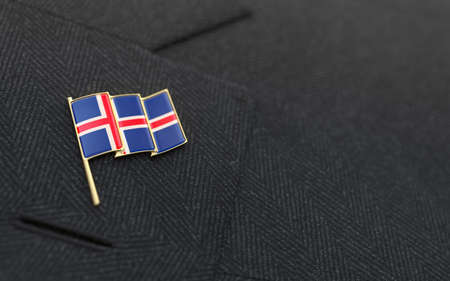 Iceland flag lapel pin on the collar of a business suit jacket shows patriotismの写真素材