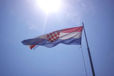 The flag of Croatia on blue sky , sunny dayの写真素材