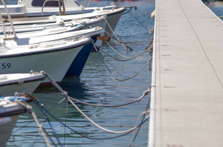 Small boats waiting to go to sea near the pierの写真素材